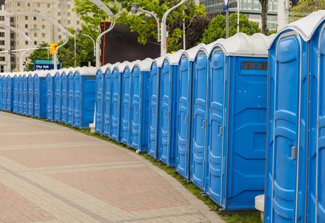 a row of portable restrooms at a fairground, offering visitors a clean and hassle-free experience in Felton, PA